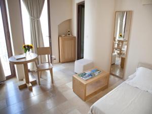 Кровать или кровати в номере La Sommità Relais & Chateaux