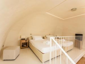 Кровать или кровати в номере La Sommità Relais & Chateaux