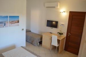 TV a/nebo společenská místnost v ubytování Guest Rooms Affittacamere