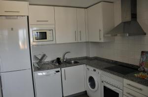 A kitchen or kitchenette at Marenia, dúplex en primera línea de playa