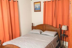 Ένα ή περισσότερα κρεβάτια σε δωμάτιο στο Frontline Apartments