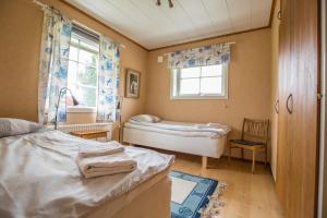 Postel nebo postele na pokoji v ubytování Nivagården