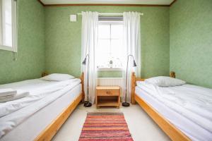 Postel nebo postele na pokoji v ubytování Nivagården