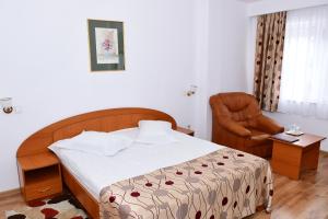 Giường trong phòng chung tại Hotel Select