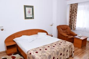 Postel nebo postele na pokoji v ubytování Hotel Select