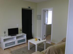 TV a/nebo společenská místnost v ubytování Casa da Aldeia