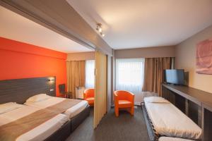 Een bed of bedden in een kamer bij Ostend Hotel