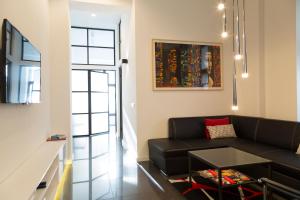 Televízia a/alebo spoločenská miestnosť v ubytovaní Art Room Boutique Apartment