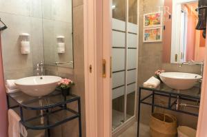 a bathroom with two sinks and a mirror at Oporto Center Clean & Cozy Apt 3 in Porto