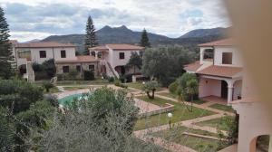 a view of a villa with a swimming pool at Appartamenti Sardegna in Porto San Paolo