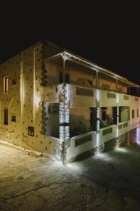 a rendering of a building at night at Viva Mare Studios in Astypalaia