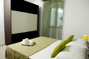 Postel nebo postele na pokoji v ubytování Apartman u srcu grada - Ilićev prolaz