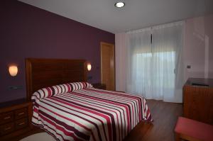 Posteľ alebo postele v izbe v ubytovaní Hotel Cachada