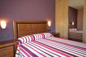 Posteľ alebo postele v izbe v ubytovaní Hotel Cachada