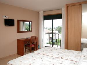 Posteľ alebo postele v izbe v ubytovaní Hotel Cachada