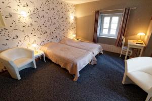Katil atau katil-katil dalam bilik di Auberge Lorraine