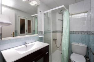 a bathroom with a sink and a shower and a toilet at Maison Lamic 2 in Lloret de Mar +14 photos
