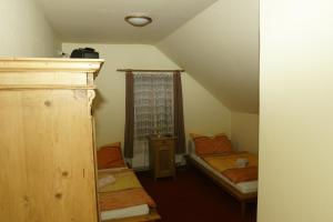 Postel nebo postele na pokoji v ubytování Hotel U Zlateho Andela