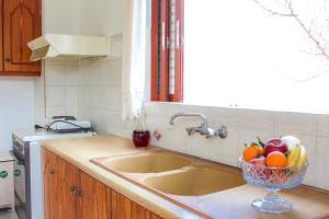 A kitchen or kitchenette at Pelagion II Sea Coral - Beachfront holiday home Még 12 kép