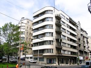 a large apartment building on a city street at Spacious Bauhaus icon flat with fitness room in Central Buda, close to the river and Margaret island in Budapest
