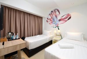 Postel nebo postele na pokoji v ubytování Hotel de Art USJ 21