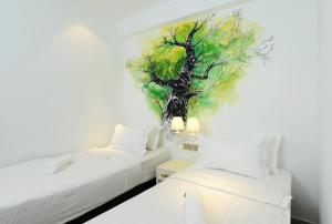 Postel nebo postele na pokoji v ubytování Hotel de Art USJ 21