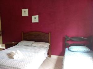 Postel nebo postele na pokoji v ubytování Pousada Portal das Flores