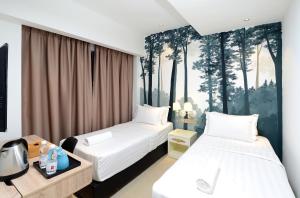 Postel nebo postele na pokoji v ubytování Hotel de Art USJ 21