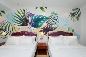 Postel nebo postele na pokoji v ubytování Hotel de Art USJ 21
