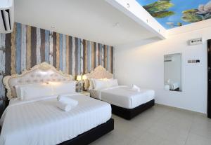 Postel nebo postele na pokoji v ubytování Hotel de Art USJ 21