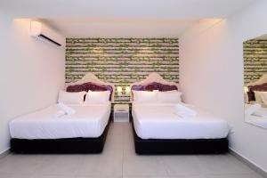 Postel nebo postele na pokoji v ubytování Hotel de Art USJ 21