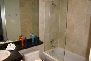 a bathroom with a shower and a toilet and a sink at Whistler Superior Properties in Whistler +45 photos