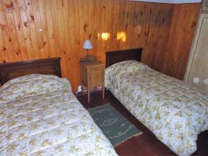 Un pat sau paturi într-o cameră la El Solar de Belén