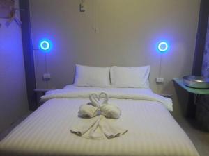 Ein Bett oder Betten in einem Zimmer der Unterkunft Thapae Gate Lodge