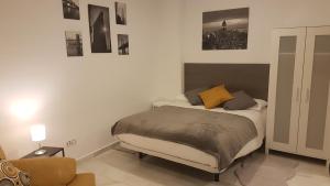 Posteľ alebo postele v izbe v ubytovaní Alcazaba Home City Centre