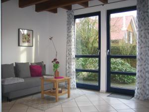 a living room with a couch and a table at Kleine Wohnung mit Terrasse in Dülmen