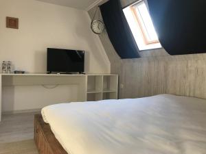 Ένα ή περισσότερα κρεβάτια σε δωμάτιο στο Family Hotel Gradina