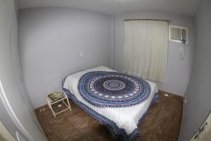 Säng eller sängar i ett rum på Residencial MBoicy