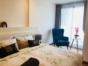 Postel nebo postele na pokoji v ubytování Astra Suites Central
