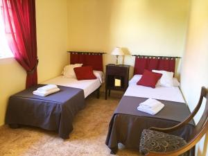 Ένα ή περισσότερα κρεβάτια σε δωμάτιο στο Caprirural