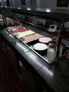 a kitchen counter with many different types of food at Kristal in Torremolinos