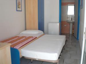 Postel nebo postele na pokoji v ubytování Guest House Matteo