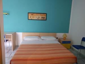 Postel nebo postele na pokoji v ubytování Guest House Matteo
