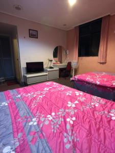 Postel nebo postele na pokoji v ubytování Ya Shi Deng Hotel