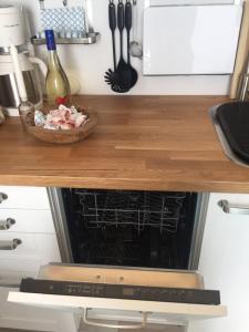 a kitchen counter with an oven with a bowl of food on it at Meeresbrise in Laboe