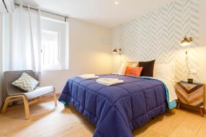 A bed or beds in a room at La Herencia del REGIDOR by Cadiz4Rentals