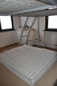 A bed or beds in a room at PudApartment Holiday Home