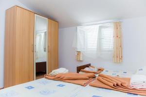 Ένα ή περισσότερα κρεβάτια σε δωμάτιο στο Apartmani Branka