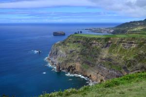 an aerial view of the cliffs next to the ocean at Our relaxing holiday home in Mosteiros