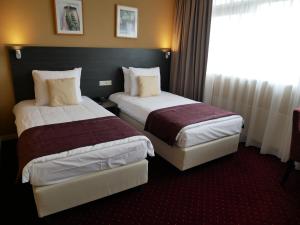 Ένα ή περισσότερα κρεβάτια σε δωμάτιο στο Hotel het Oosten